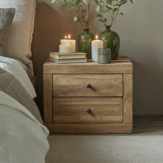 Handcrafted wooden nightstand with dual drawers and clean, functional lines, offering storage and a minimalist aesthetic